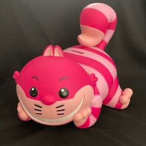 Cheshire Cat pls coin bank. NWOT Pink, black, beige light pink stripes.